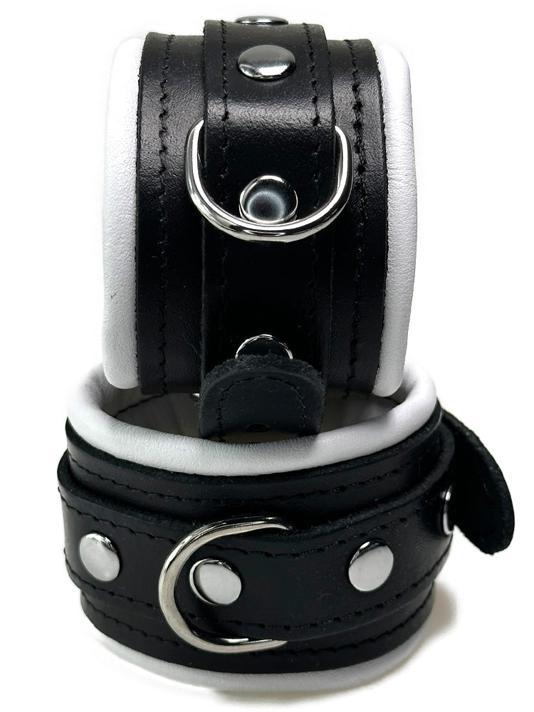 Leder-Handfesseln schwarzer Riemen, weiß gepolstert 5cm